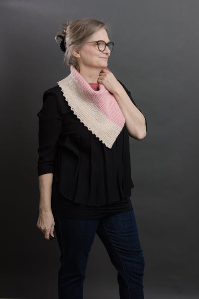 designer modeling a handknit cowl pattern