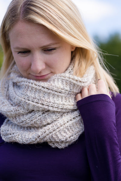 scarf wrapped cozy on young woman