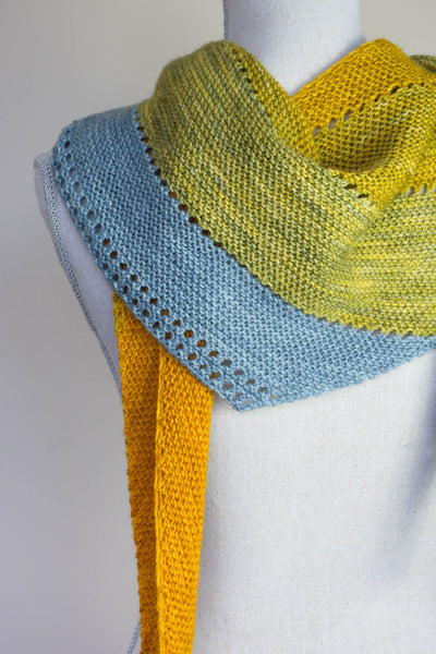SIdeways triangle scarf with eyelets on a Manniquin